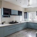 Slate Blue Matte L-Shaped Modular Kitchen with Black Gloss Upper Cabinets, White Quartz Countertop, Open Spice Shelf and Black Chimney Hood